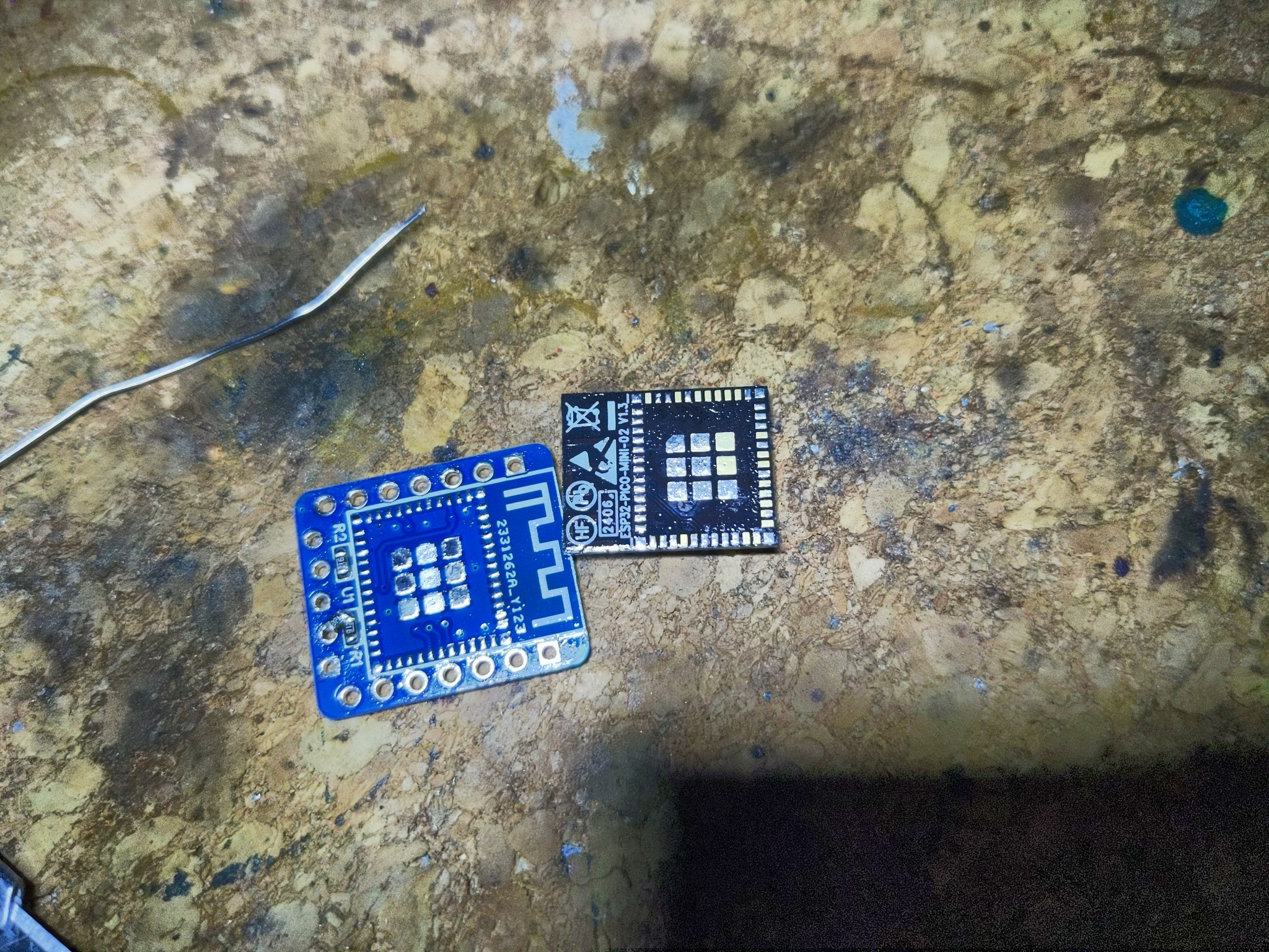 Desoldered esp32 module with many pads not touched by solder.