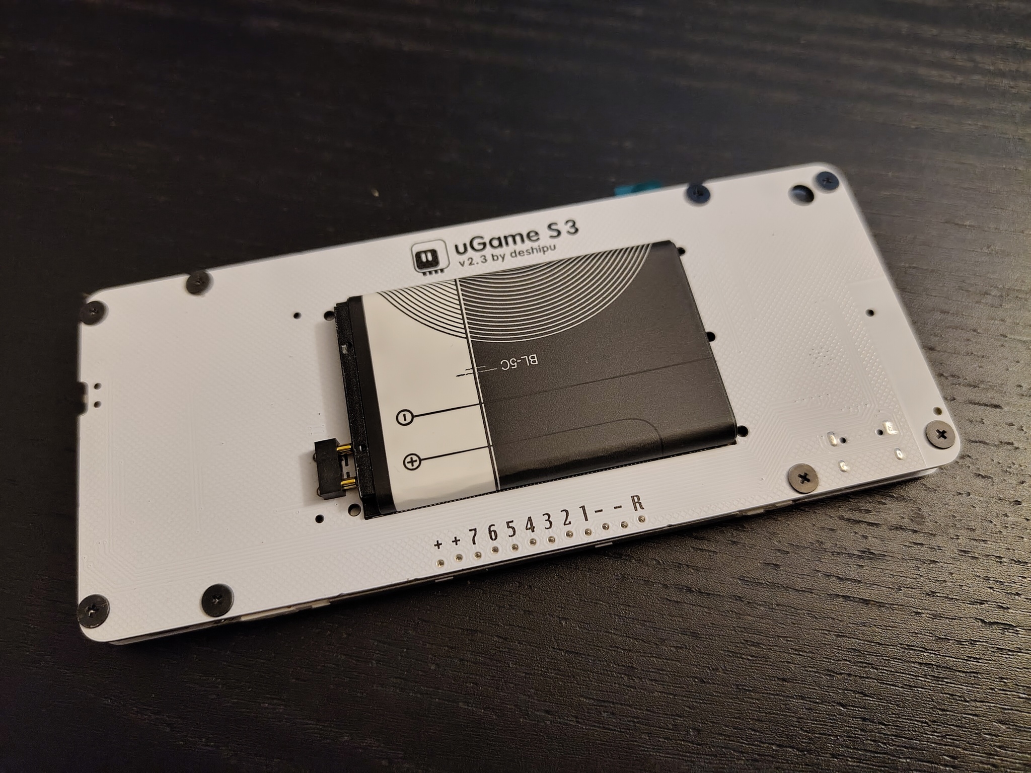 Screws at the back of the device.